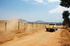 Pick-up truck in dirt road
