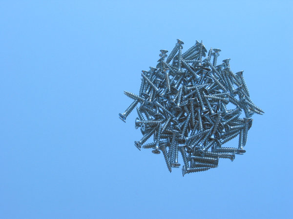 screw textures 2: screws on a mirror with daylight sky.