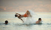 Young boys jumping in the sea