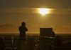 Photographer in sunset