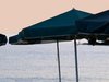 Sunshades, water and a pink sk