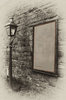 Old sign with gas lamp
