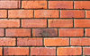 up against a brick wall