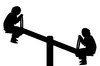 Silhouette children on seesaw