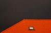 Red tiled roof against rainy s