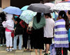 queuing in the rain