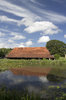 Barn by a moat