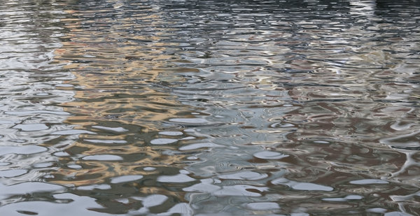 Ripples and reflections: Ripples and reflections of water in a quay in Denmark.