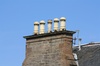 Chimney pots against blue sky